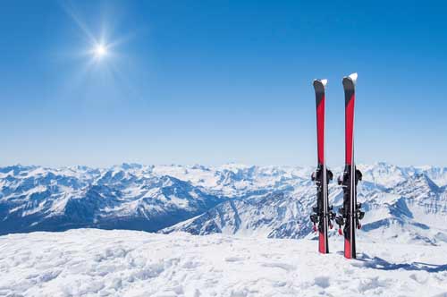 Pair of skis in snow on a mountain